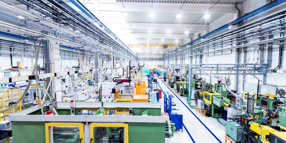 interior of a mechanical factory line with no workers and bright lights
