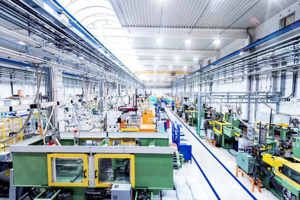 interior of a mechanical factory line with no workers and bright lights