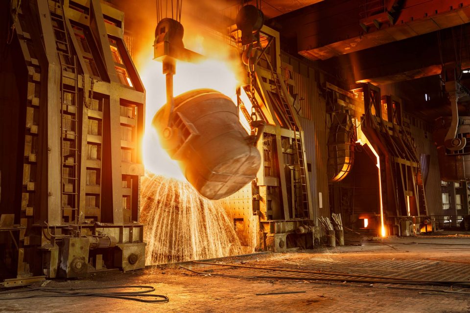 industrial steel factory illuminated by sparks and fire